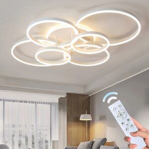 Biała lampa z okręgów nad salonem, sterowanie pilotem